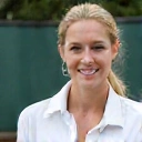 Professional headshot of Coach Sarah Miller, a female tennis coach with a confident expression.